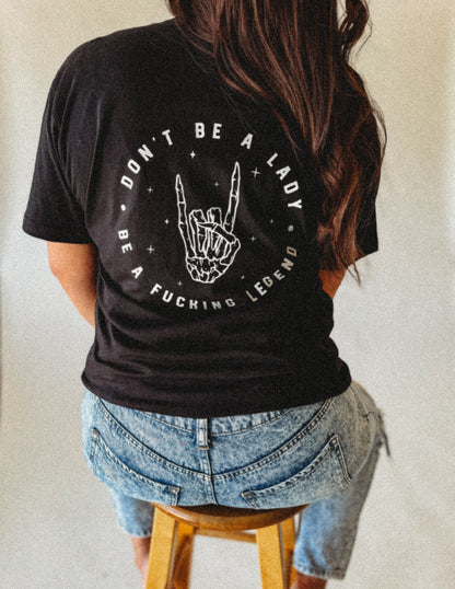 DON’T BE A LADY BE A FUCKING LEGEND- Women’s Tee